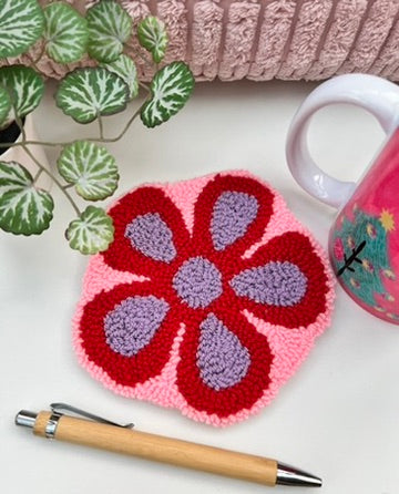 Punch needle mug-rug / coaster - funky 70s flower