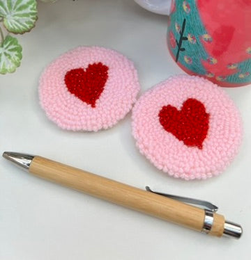 Pair of punch needle car coasters - pink yarn and sparkly hearts