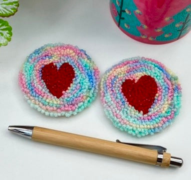 Pair of punch needle car coasters - rainbow yarn and sparkly hearts